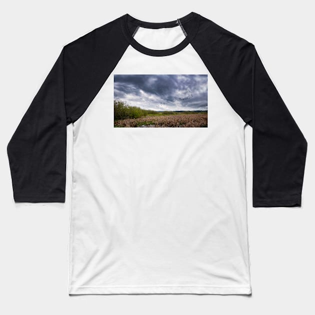 Geese Flying Off Under Stormy Skies Baseball T-Shirt by JeffreySchwartz